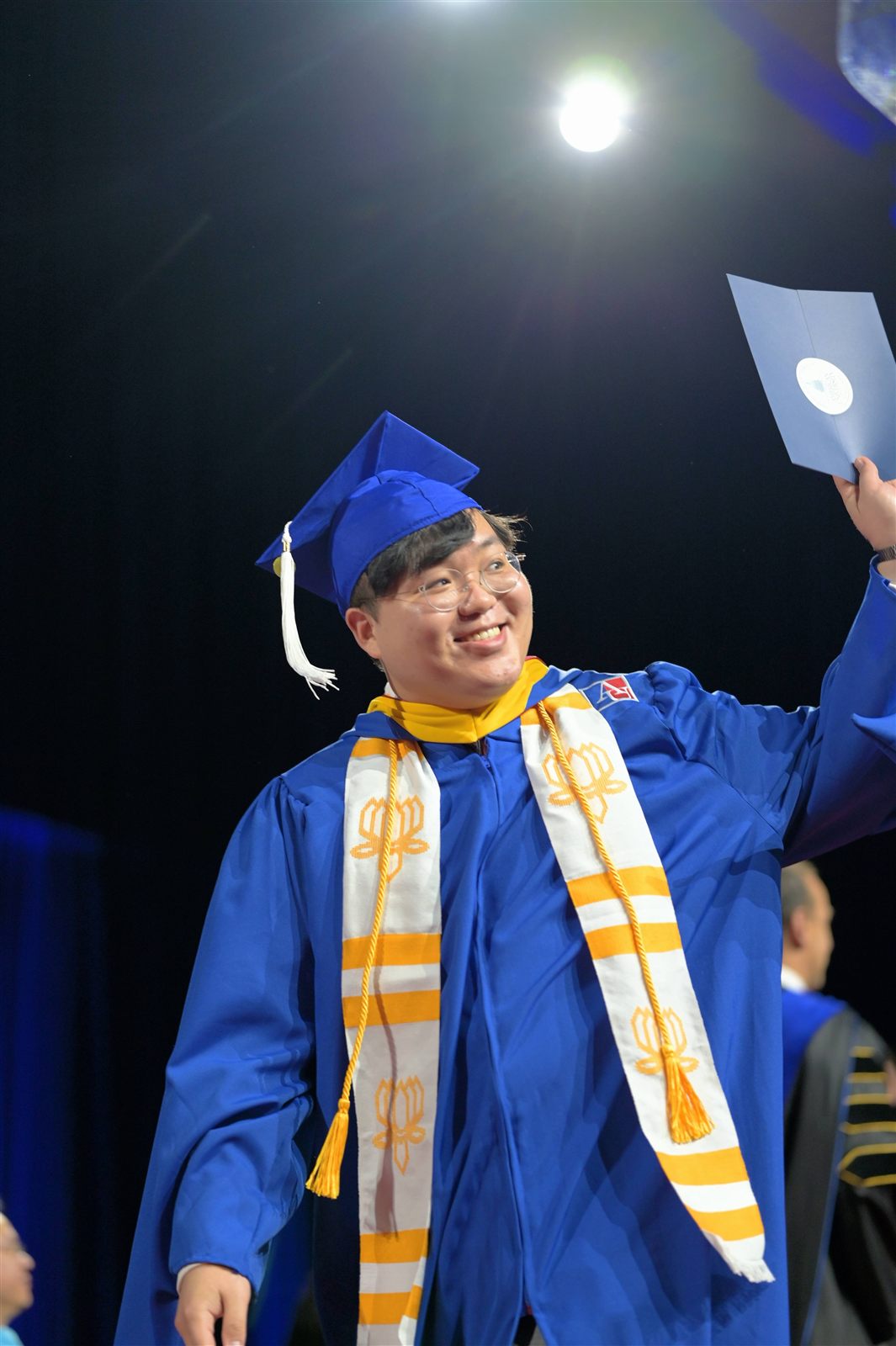 Crossing the stage at Commencement, Kogod School of Business